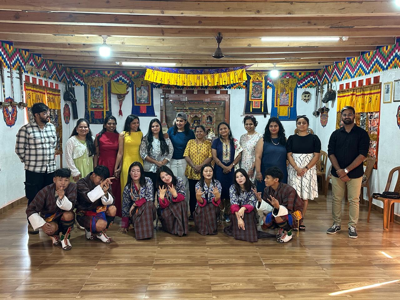 TrekPanda travellers with Bhutanese hosts during a traditional cultural evening